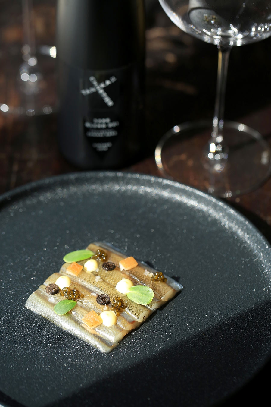 Marinated smelts with grapefruit juice and fennel seeds. Pork rind ...